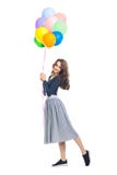 Happy beautiful woman holding colorful balloons isolated on whit royalty free stock images Happy beautiful woman holding colorful balloons isolated on whit royalty free stock images