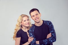 Young romantic couple standing together stock photo Young romantic couple standing together stock photo