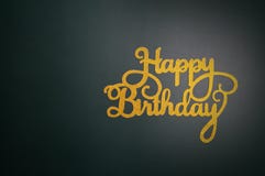 Happy birthday hand lettering with gold glitter.