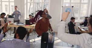 Happy black female corporate manager doing fun crazy victory celebration dance at modern trendy office workplace. stock video Happy black female corporate manager doing fun crazy victory celebration dance at modern trendy office workplace. stock video