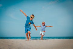Happy boy and girl run play at beach royalty free stock images Happy boy and girl run play at beach royalty free stock images