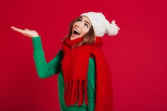 Happy brunette woman in sweater, funny hat and scarf royalty free stock images Happy brunette woman in sweater, funny hat and scarf royalty free stock images
