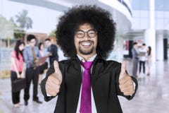 Happy business leader with team members in the background stock photo Happy business leader with team members in the background stock photo