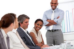 Happy businessman doing a presentation stock images Happy businessman doing a presentation stock images