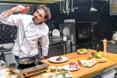 happy chef looking at cherry royalty free stock photos happy chef looking at cherry royalty free stock photos