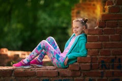 Happy small child jumping active for pleasure. Active and energetic girl having fun in summer. The concept of sports, dance, hip royalty free stock photo Happy small child jumping active for pleasure. Active and energetic girl having fun in summer. The concept of sports, dance, hip royalty free stock photo