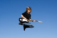 Happy child playing guitar