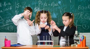 Happy children. Biology lesson. Little kids learning chemistry in lab. biology education. students doing biology stock photos Happy children. Biology lesson. Little kids learning chemistry in lab. biology education. students doing biology stock photos