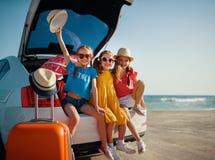 Happy children girls friends sisters on the car ride to summer trip stock photography Happy children girls friends sisters on the car ride to summer trip stock photography