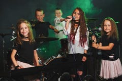 Happy children singing and playing music stock photography Happy children singing and playing music stock photography