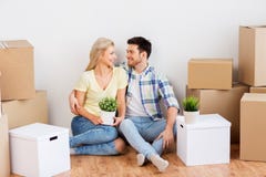 Happy couple with boxes moving to new home royalty free stock image Happy couple with boxes moving to new home royalty free stock image