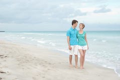 Happy Couple On The Beach Stock Photos Happy Couple On The Beach Stock Photos