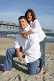 Happy Couple On The Beach Stock Photo