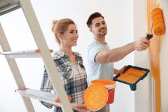 Happy Couple Painting Wall. Home Repair Stock Photography Happy Couple Painting Wall. Home Repair Stock Photography