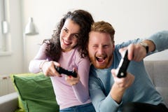 Happy couple playing video games at home Royalty Free Stock Image Happy couple playing video games at home Royalty Free Stock Image