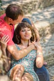 Happy couple on vacation. Happy guy and girl. Lovers enjoy each other in the evening park royalty free stock photo Happy couple on vacation. Happy guy and girl. Lovers enjoy each other in the evening park royalty free stock photo