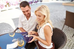 Happy couple with wallet paying bill at restaurant stock photo Happy couple with wallet paying bill at restaurant stock photo
