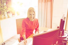 Happy creative female office worker with computers stock photography Happy creative female office worker with computers stock photography