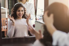 Happy Customer Looking In Mirror After Haircut Stock Photos