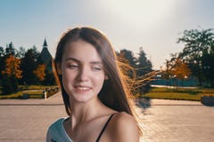 Cute girl looking down in summer day backlit royalty free stock photo Cute girl looking down in summer day backlit royalty free stock photo
