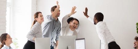 Happy diverse millennial workmates giving high five celebrating corporate success royalty free stock photos Happy diverse millennial workmates giving high five celebrating corporate success royalty free stock photos