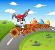 Happy easter bunny driving a timber train carrying Easter eggs vector illustration Happy easter bunny driving a timber train carrying Easter eggs vector illustration