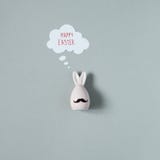 Happy Easter. Funny easter bunny with mustache on gray background royalty free stock images Happy Easter. Funny easter bunny with mustache on gray background royalty free stock images