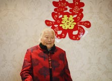 Happy elderly Asian Chinese 90s old woman portrait on her grandson wedding royalty free stock image Happy elderly Asian Chinese 90s old woman portrait on her grandson wedding royalty free stock image