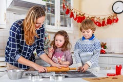 Happy family baking Christmas cookies at home royalty free stock photos Happy family baking Christmas cookies at home royalty free stock photos