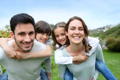 Happy family in beautiful garden stock photography Happy family in beautiful garden stock photography