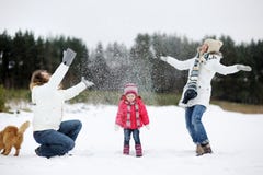 Happy family and a cat on a winter day royalty free stock photo Happy family and a cat on a winter day royalty free stock photo
