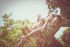 Happy family enjoying together in summer day. stock photos Happy family enjoying together in summer day. stock photos