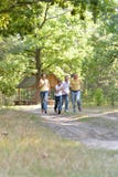 Portrait of happy family of four in autumn park running stock image Portrait of happy family of four in autumn park running stock image