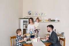 Happy family having breakfast at home stock image Happy family having breakfast at home stock image
