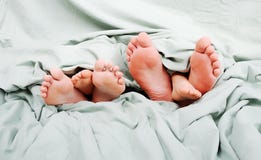 Happy Family In Bed Stock Photos
