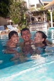 Happy Family In Swimming Pool Royalty Free Stock Photography