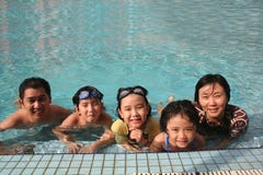 Happy Family In The Pool Royalty Free Stock Photography