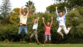 Happy family jumping together
