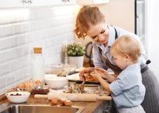 Happy family in kitchen. mother and child baking cookies Royalty Free Stock Photos Happy family in kitchen. mother and child baking cookies Royalty Free Stock Photos