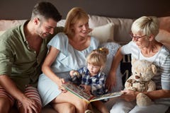 Family with little child having fun with grandma stock photos Family with little child having fun with grandma stock photos