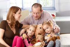 Happy family with little daughters at home royalty free stock image Happy family with little daughters at home royalty free stock image