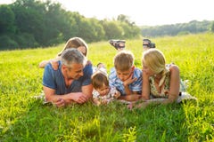 Happy family lying on the grass. stock images Happy family lying on the grass. stock images