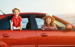Happy family mother and child boy goes to summer travel trip in car stock images Happy family mother and child boy goes to summer travel trip in car stock images