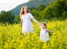 Happy family, mother and child l little daughter running on mea stock photography Happy family, mother and child l little daughter running on mea stock photography