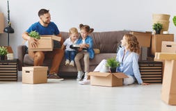 Happy family mother father and children move to new apartment an stock image Happy family mother father and children move to new apartment an stock image