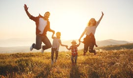 Happy family: mother, father, children son and daughter on sunse Royalty Free Stock Images Happy family: mother, father, children son and daughter on sunse Royalty Free Stock Images