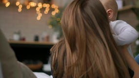 Happy family. Mother playing with her baby in the bedroom. Laughing and smiling. stock video Happy family. Mother playing with her baby in the bedroom. Laughing and smiling. stock video