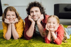 happy family with one child lying together and smiling royalty free stock image happy family with one child lying together and smiling royalty free stock image