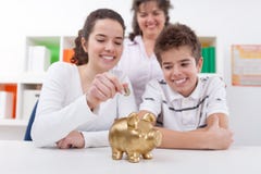 Happy family with piggybank Stock Photo Happy family with piggybank Stock Photo