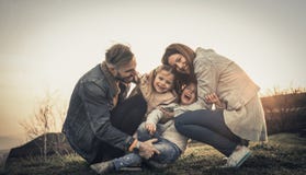 Happy family playing outdoor. Family enjoying together in nature royalty free stock photography Happy family playing outdoor. Family enjoying together in nature royalty free stock photography